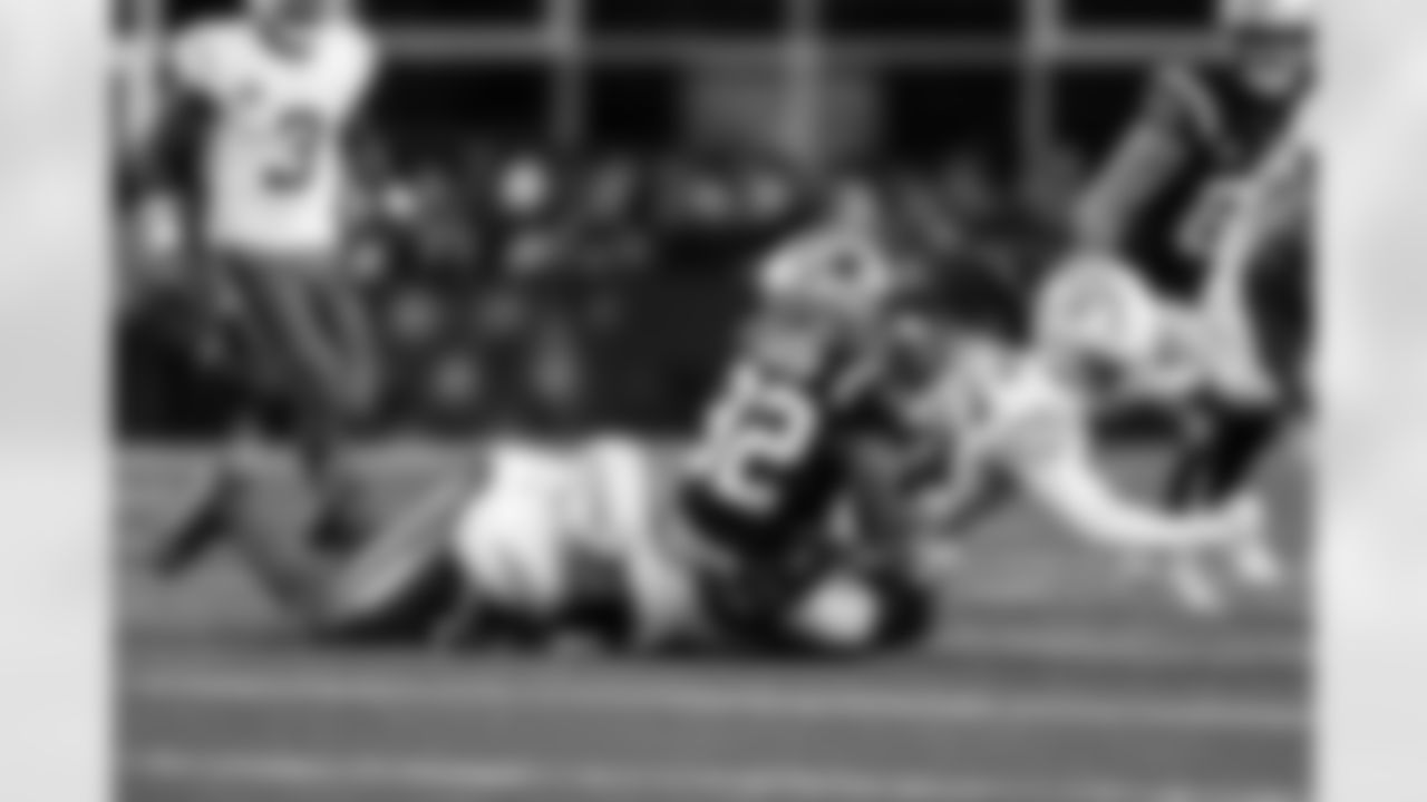 CB Donte Jackson (26) and LB Daiyan Henley (0)