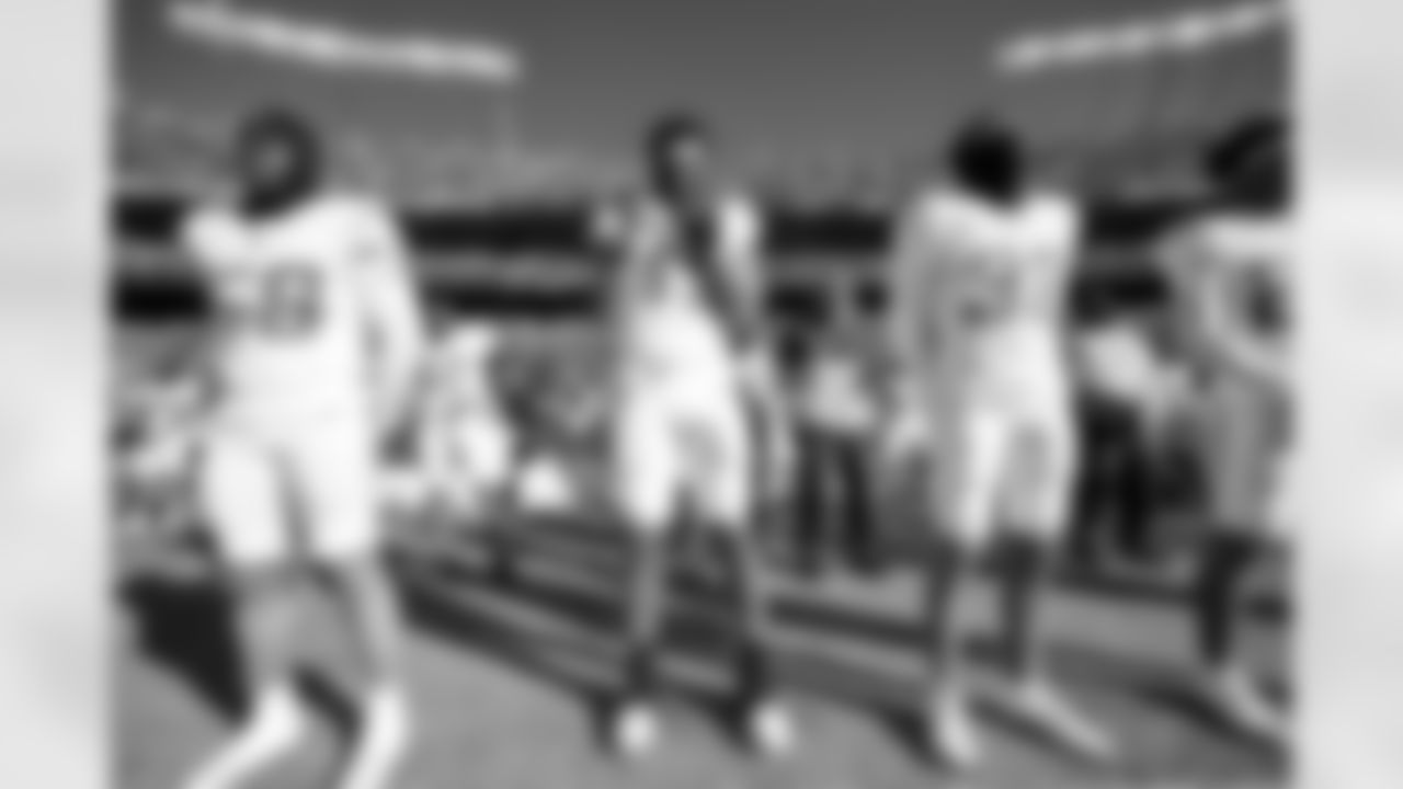 LB Marlowe Wax (58), LB Troy Dye (43) and DB Deane Leonard (33)