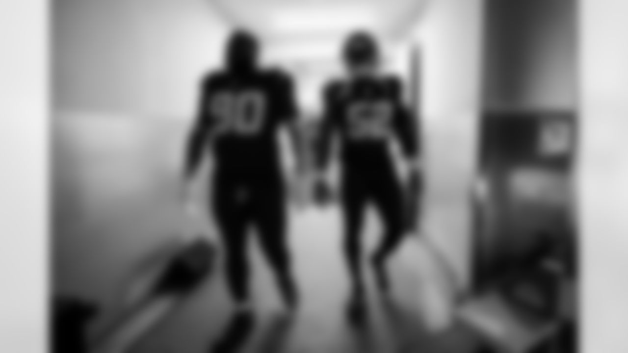 DL Teair Tart (90) and OLB Khalil Mack (52)