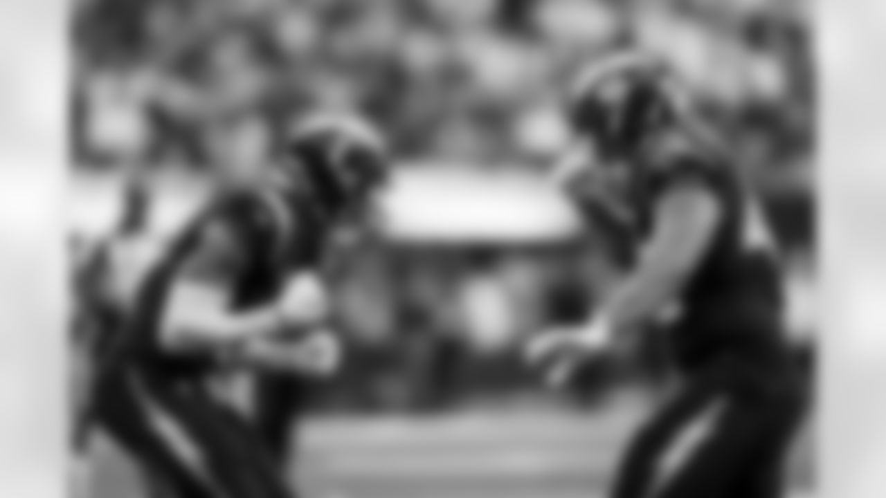 Chargers S Derwin James, Jr. (#3) OLB Tuli Tuipulotu (#45)  in action during their Pro Bowl season.