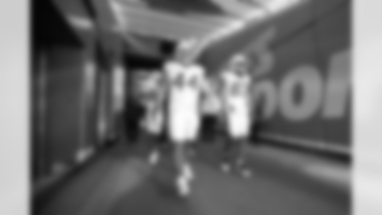 DL Scott Matlock (44) and TE Tyler Conklin (83)