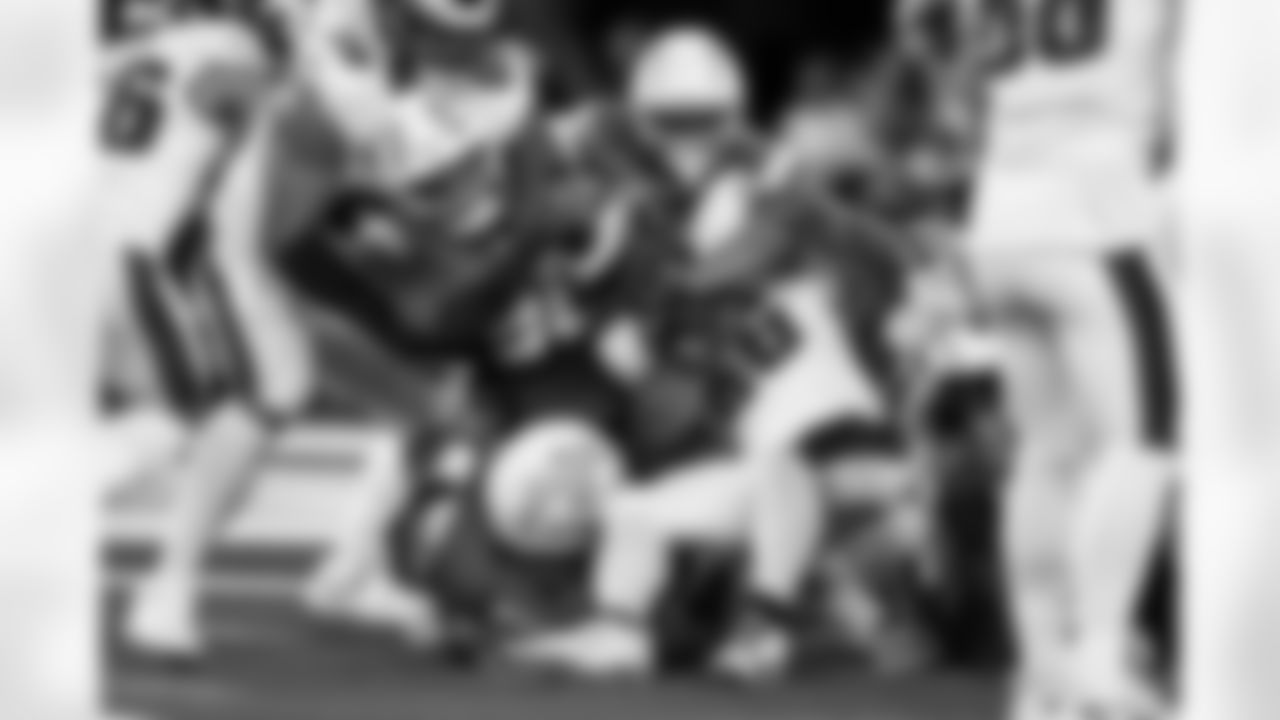 OLB Khalil Mack (52) and DL Teair Tart (90)