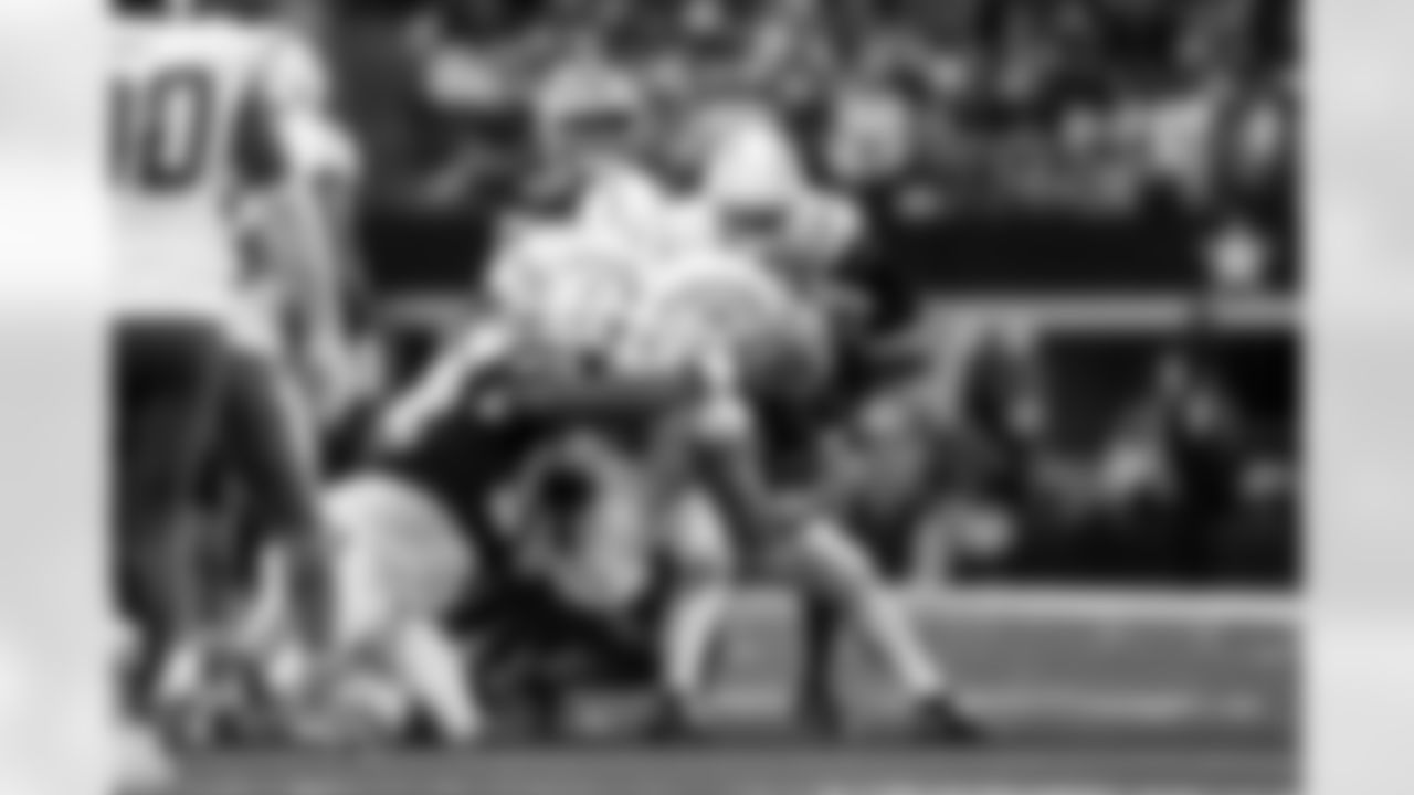 DB Elijah Molden (2) and OLB Tuli Tuipulotu (45)