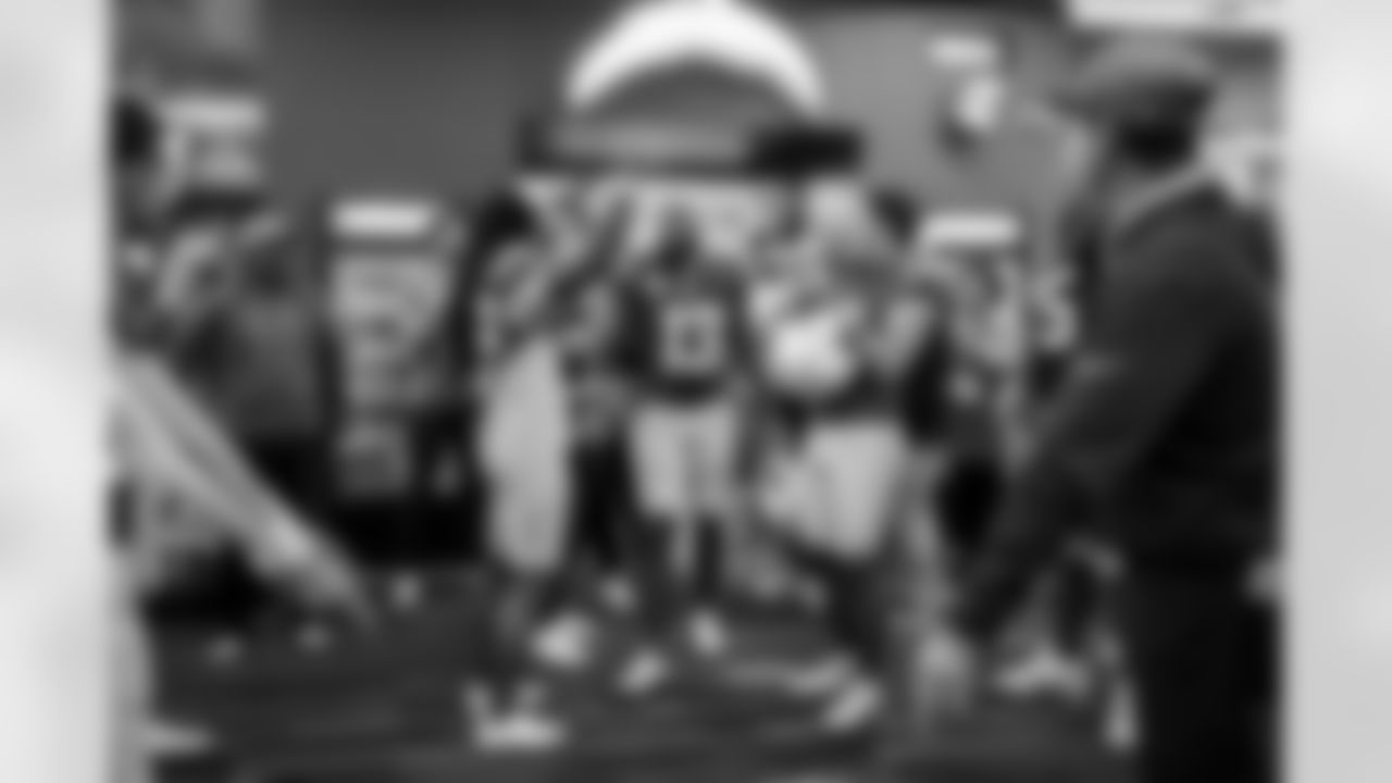 WR Keenan Allen (13), CB Donte Jackson (26) and K Cameron Dicker (11)