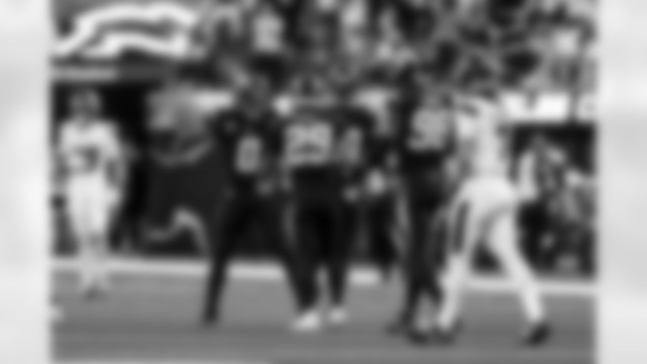 LB Daiyan Henley (0), CB Tarheeb Still (29) and OLB Odafe Oweh (98)