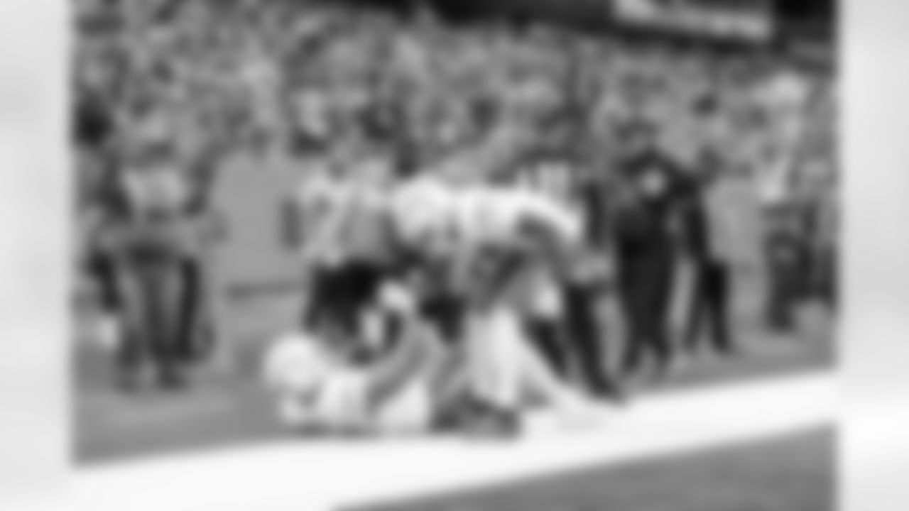 DL Scott Matlock (44) and WR Tre Harris (9)