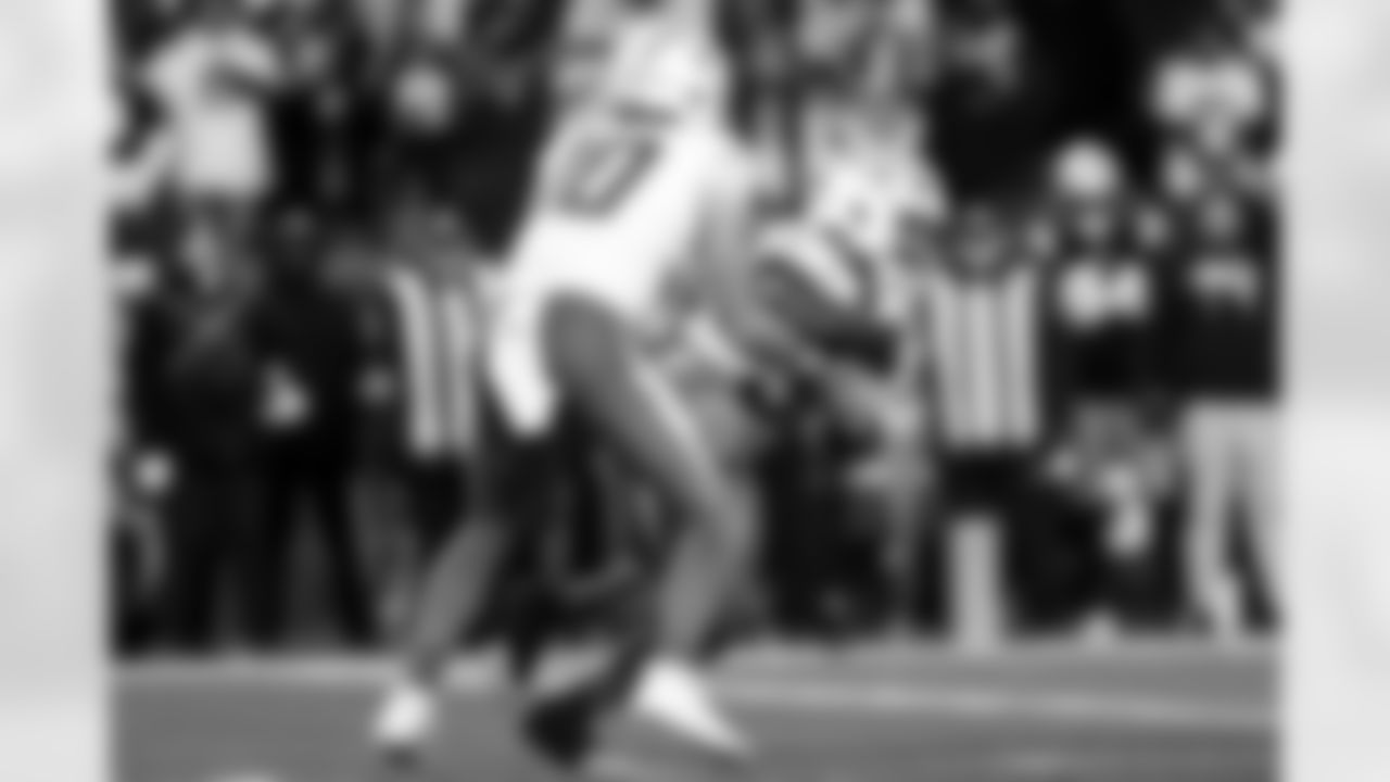 QB Justin Herbert (10) and RB Kimani Vidal (30)