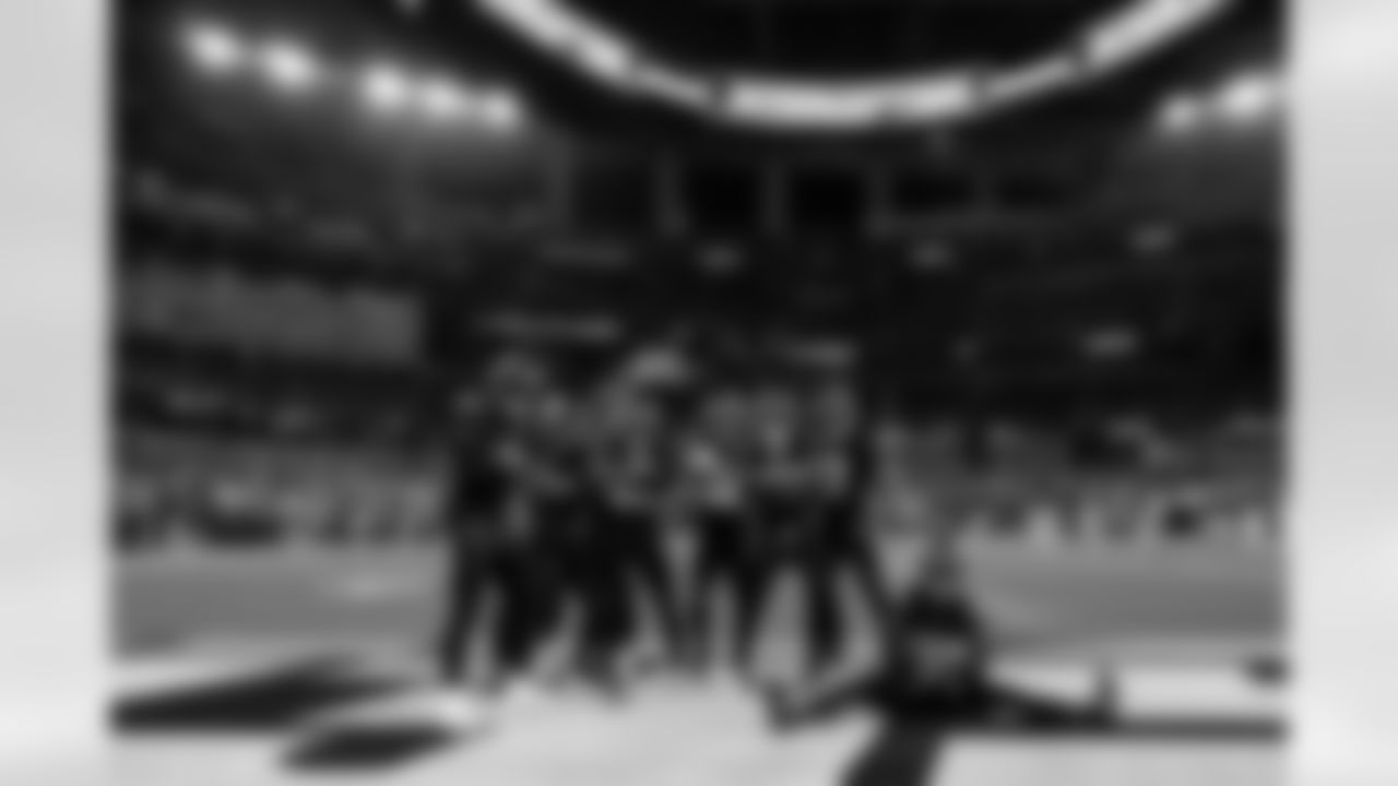 Primetime Group Photo - After RJ Mickens grabbed the first interception of his career in Week 8 against the Vikings, Daiyan Henley knew where to take him. Henley found Mickens following the play and pointed him towards the endzone, where I was standing and waving at them. We always have someone stationed in the endzone for these celebration photos, and waited until the whole squad got there. I took a couple tight also but liked this wide one best cause it showed the 'INTERCEPTION' graphic on the infinity screen, something you can only get at SoFi.