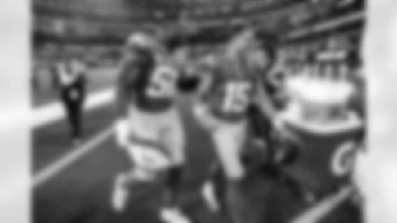 OLB Khalil Mack (52) and WR Ladd McConkey (15)