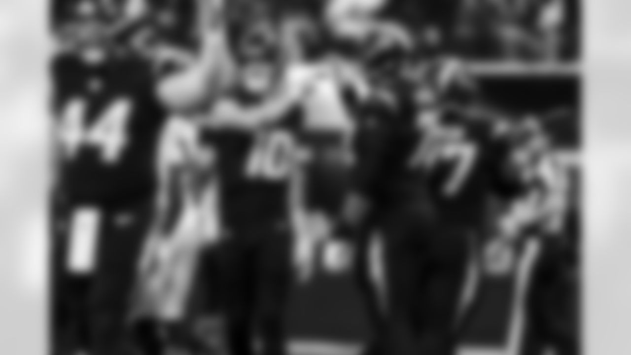 QB Justin Herbert (10) and T Trey Pipkins III (79)