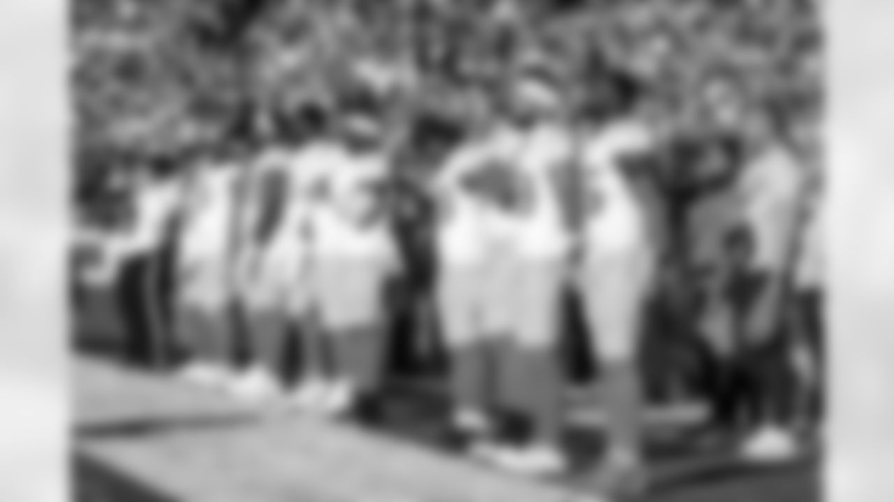 DB Deane Leonard (33) and S Marcus Maye