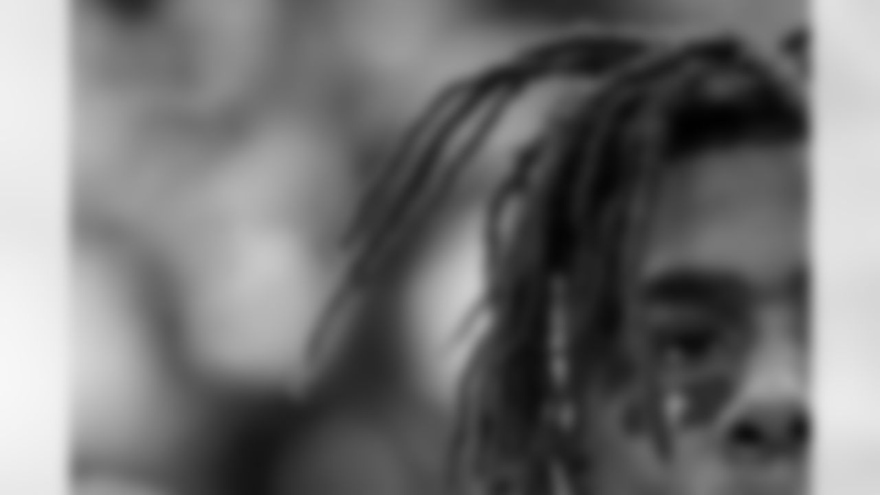 All in the Details - This close up shot came right before the Chargers kicked off in Week 9 against Tennessee. It was a quiet moment during the anthem as the players lined up on the sideline. This detail shot shows the cross on RJ's eye black, plus his hair.