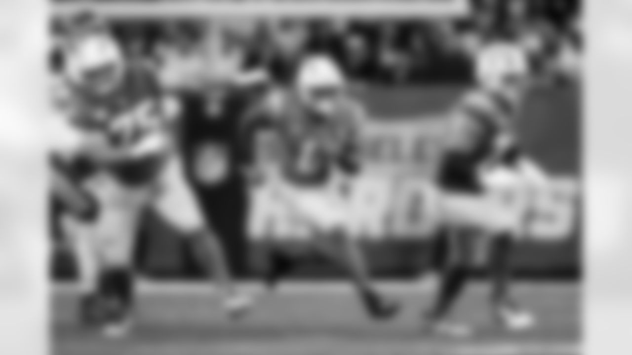 C Bradley Bozeman (75) and RB Omarion Hampton (8)