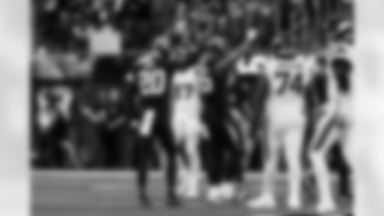 CB Cam Hart (20) and OLB Tuli Tuipulotu (45)