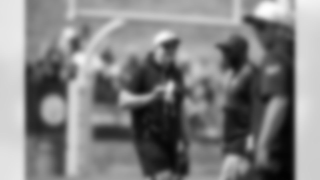 Pittsburgh Steelers head coach Mike Tomlin, right, talks with offensive coordinator Arthur Smith during the NFL football team's training camp in Latrobe, Pa., Thursday, July 24, 2025. (AP Photo/Gene J. Puskar)