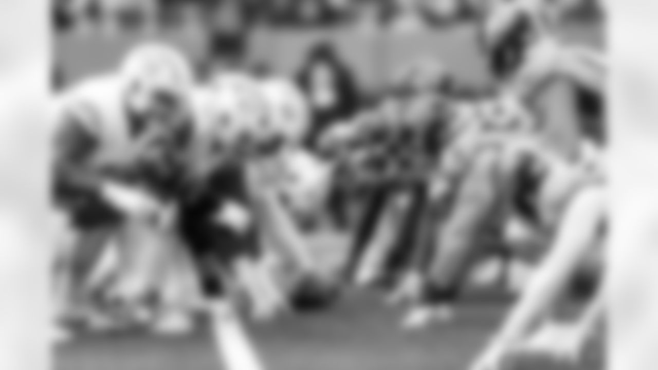 OL Foster Sarell (67), OL Jamaree Salyer (68) and LS Rick Lovato (41)