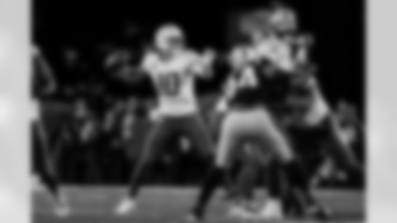 Check out the best shots from the Chargers Wild Card matchup against the Patriots!