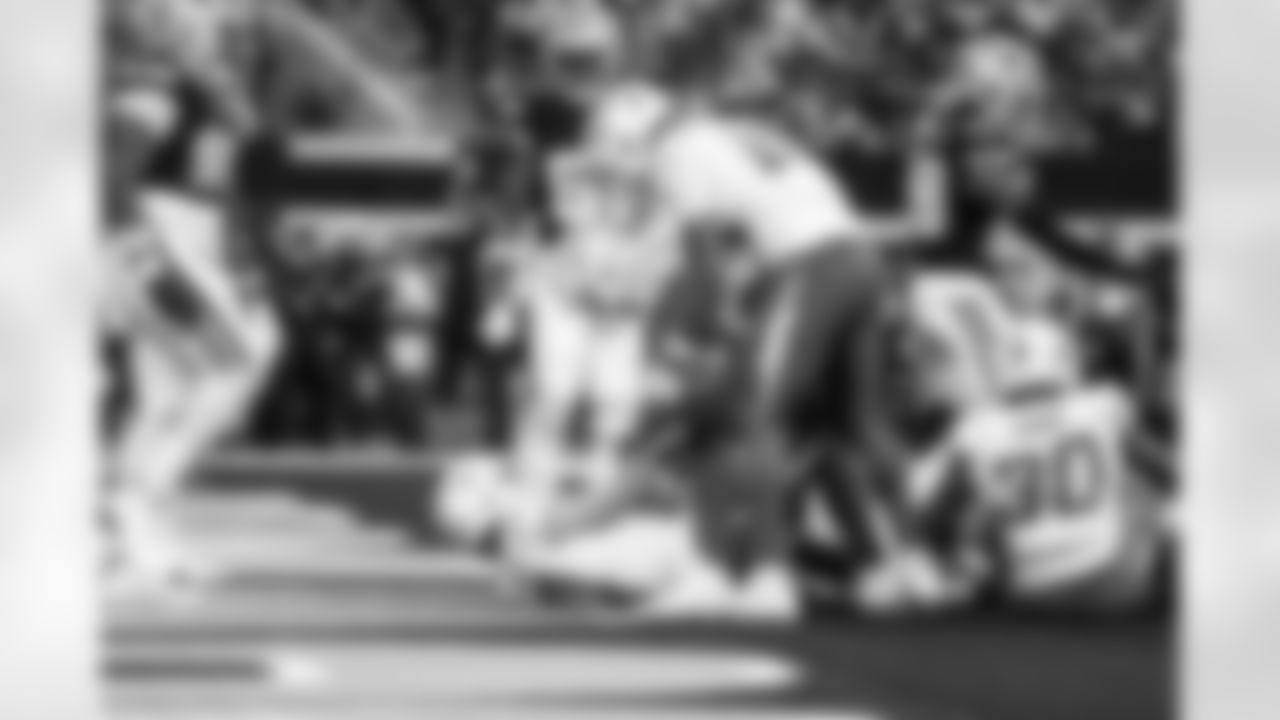 QB Justin Herbert (10) and DL Scott Matlock (44)