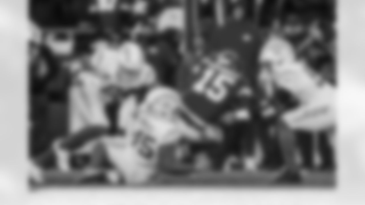 OLB Tuli Tuipulotu (45) and OLB Khalil Mack (52)