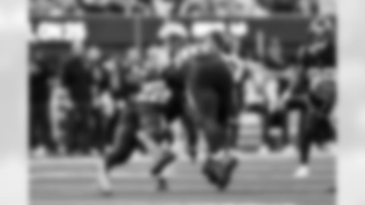 DL Teair Tart (90) and OLB Khalil Mack (52)