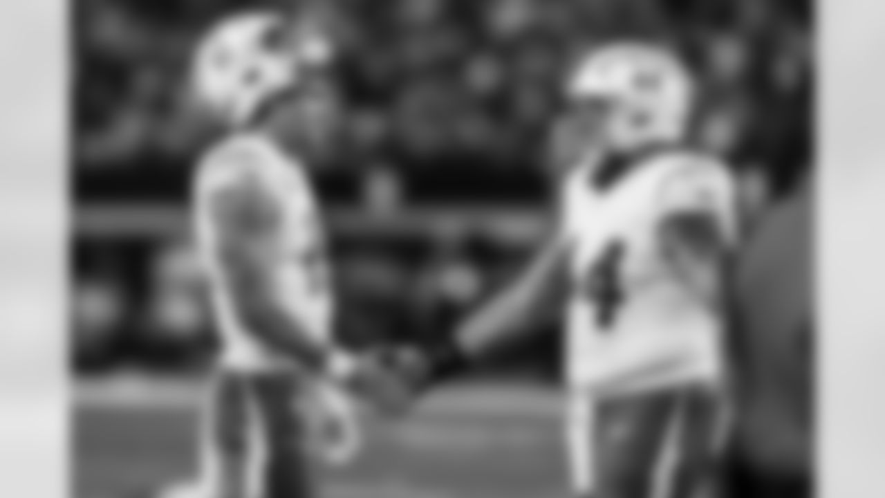 QB Justin Herbert (10) and DL Scott Matlock (44)