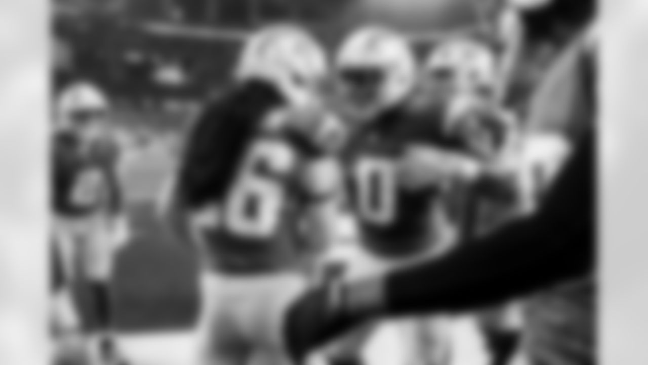 LB Daiyan Henley (0) and CB Donte Jackson (26)