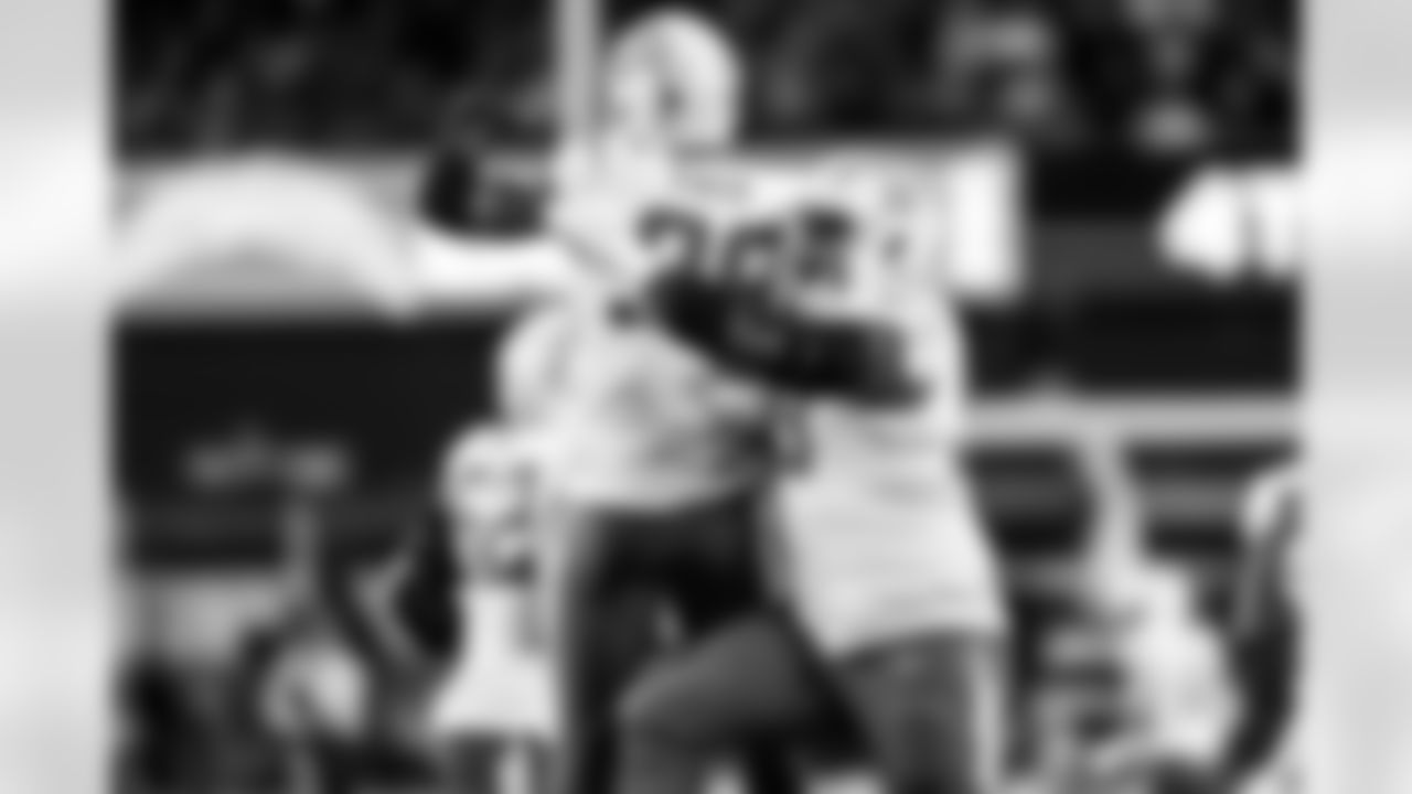 OLB Odafe Oweh (98) and DL Otito Ogbonnia (93)