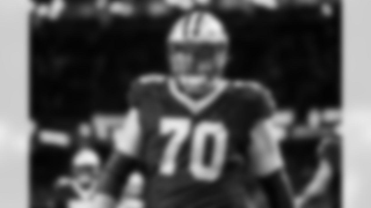 New Orleans Saints offensive tackle Trevor Penning (70) looks on from the field during an NFL football game against the Las Vegas Raiders, Sunday, Dec. 29, 2024, in New Orleans. The Raiders defeated the Saints 25-10. (Cooper Neill via AP)