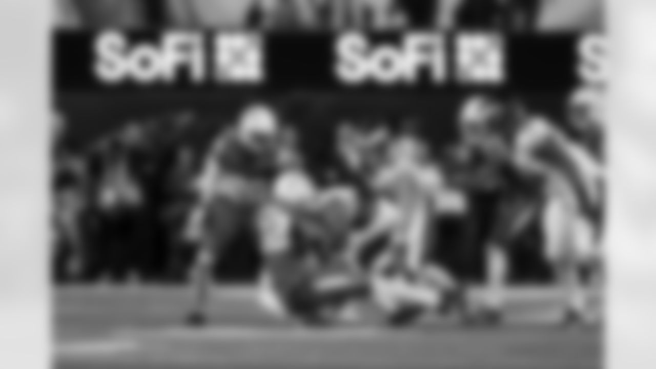 CB Cam Hart (20) and OLB Khalil Mack (52)