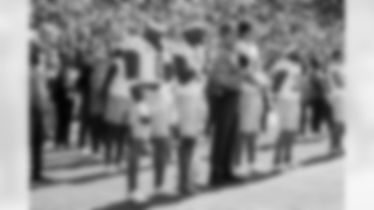 LB Daiyan Henley (0), S Derwin James Jr. (3), Head Coach Jim Harbaugh and QB Justin Herbert (10)