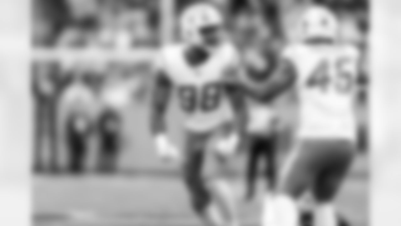 OLB Odafe Oweh (98) and OLB Tuli Tuipulotu (45)