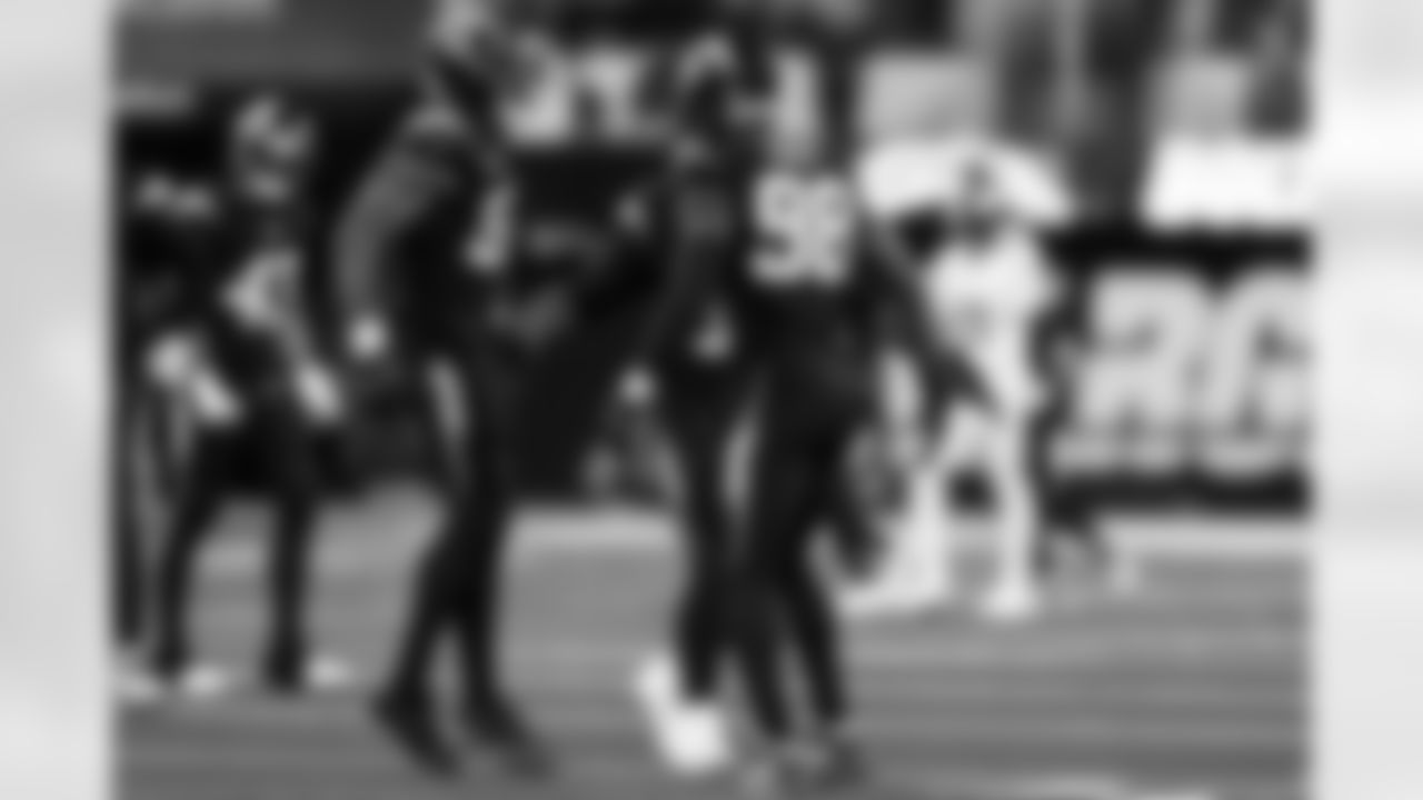 OLB Khalil Mack (52) and OLB Odafe Oweh (98)