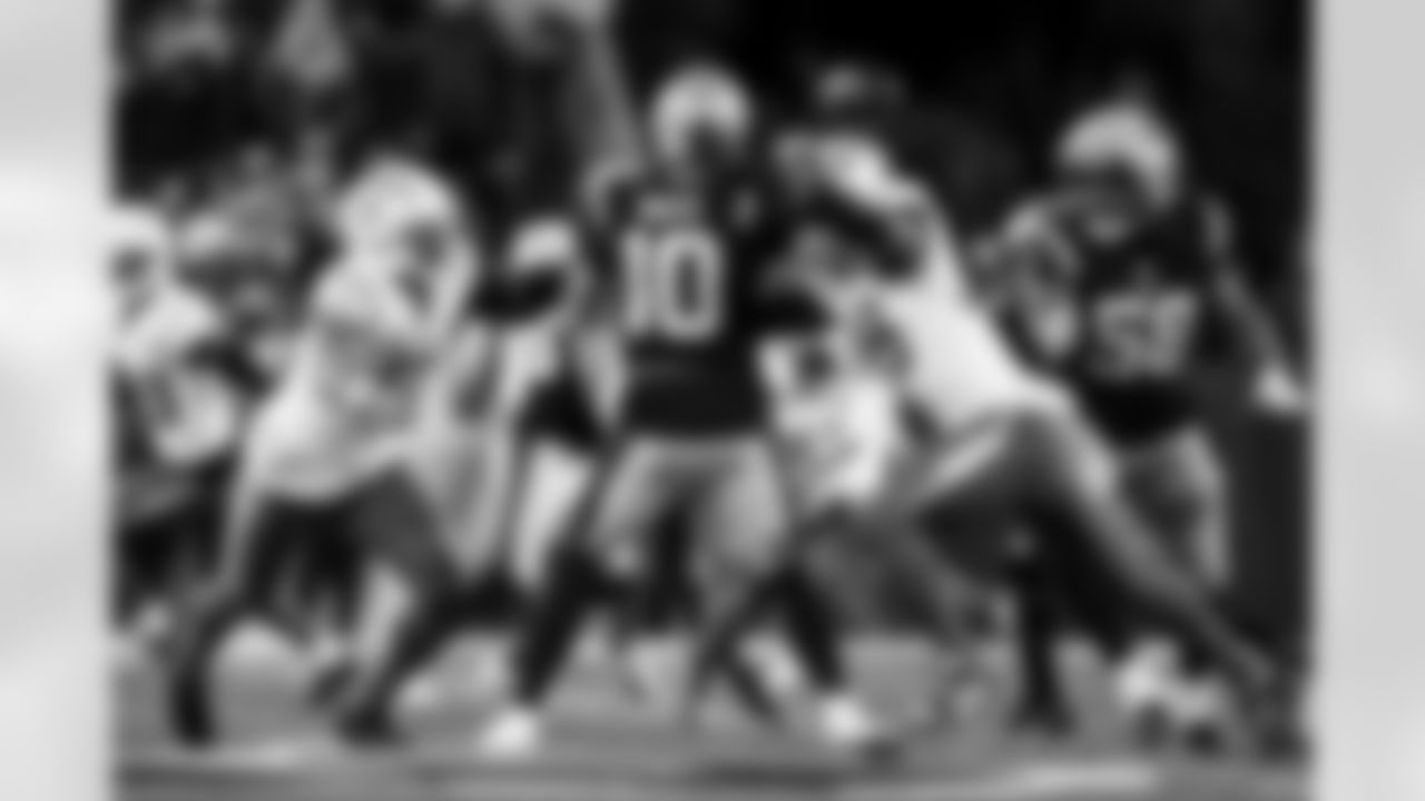 OLB Khalil Mack (52) and OLB Odafe Oweh (98)