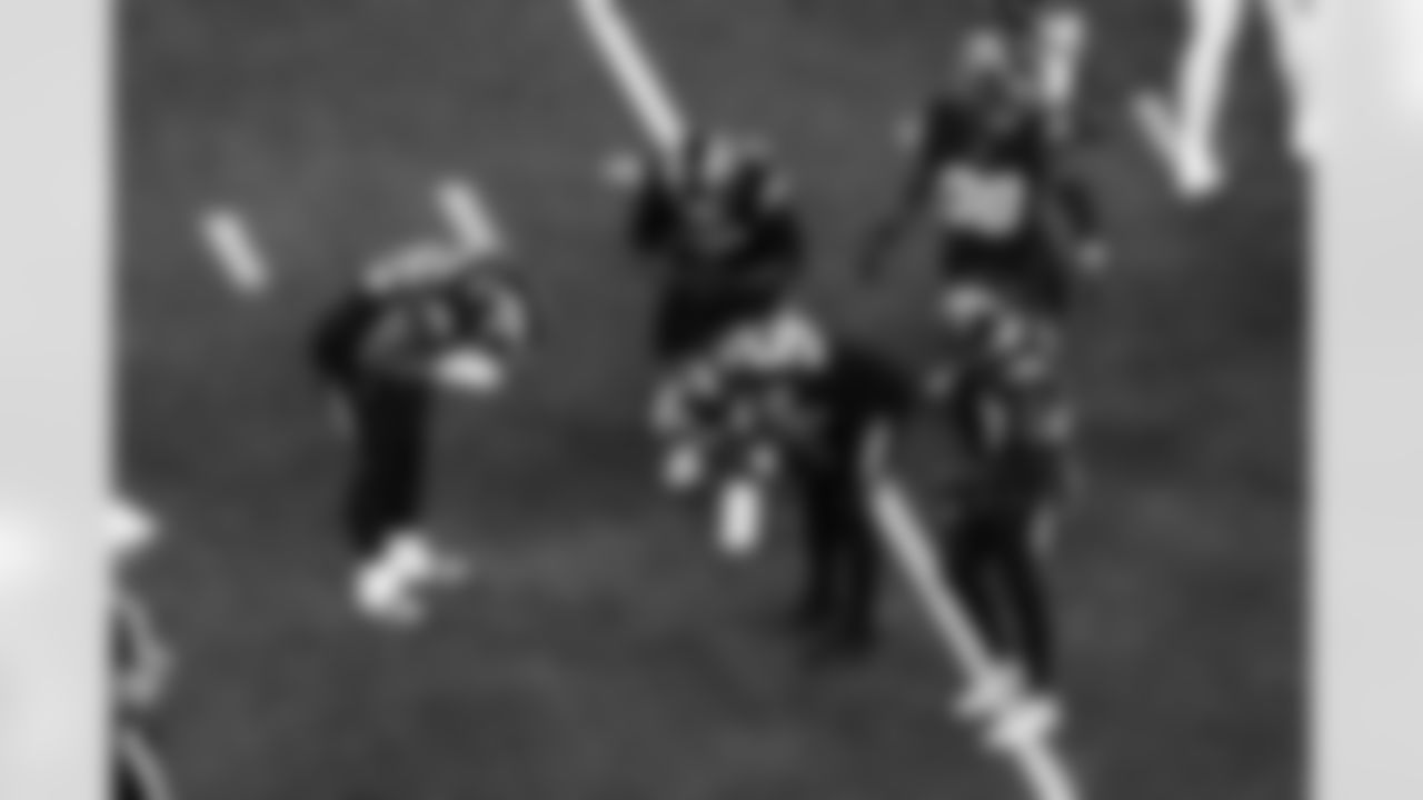 OLB Tuli Tuipulotu (45) and OLB Khalil Mack (52)