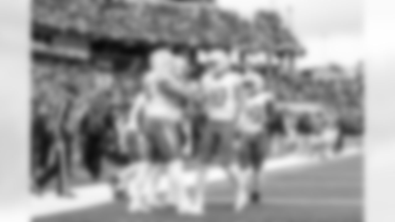 DL Scott Matlock (44) and QB Justin Herbert (10)