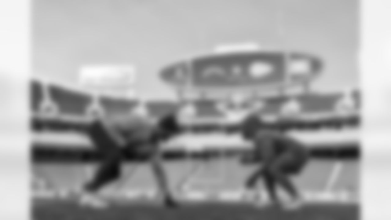 Assistant Offensive Line Coach Nick Hardwick and G Zion Johnson (77)