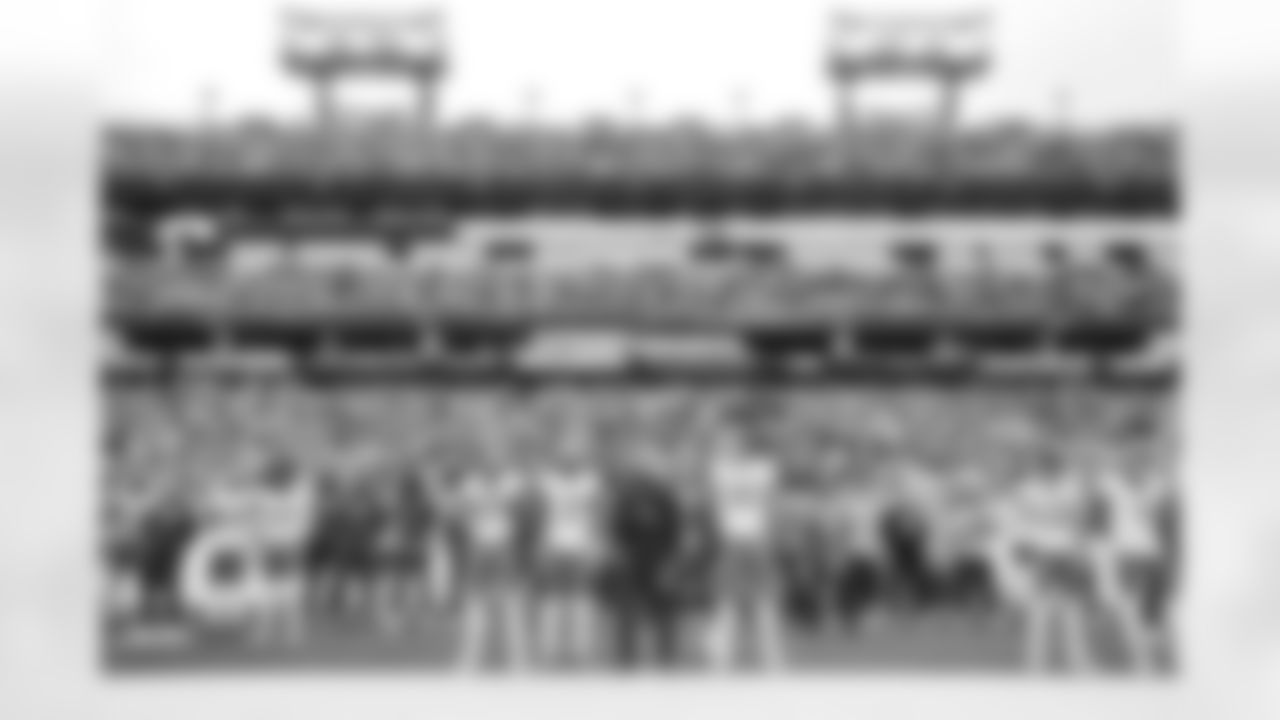 LB Daiyan Henley (0), S Derwin James Jr. (3), Head Coach Jim Harbaugh and QB Justin Herbert (10)