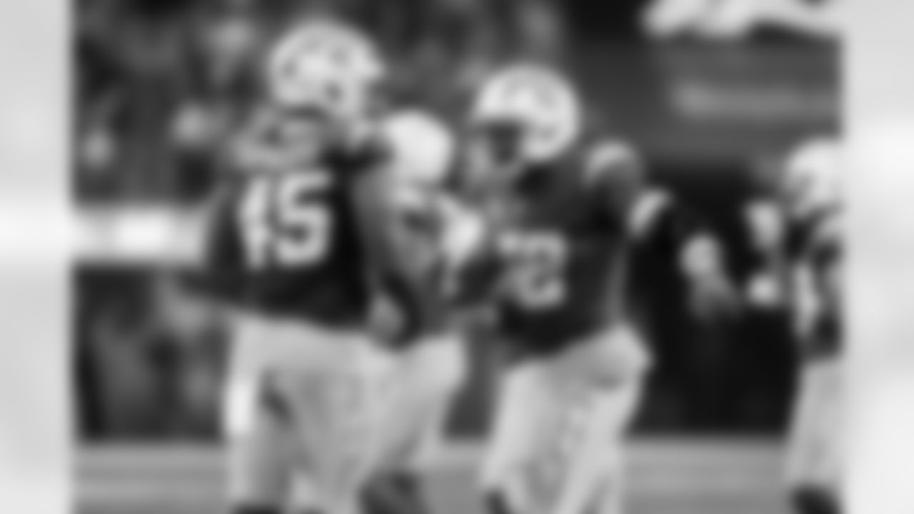 OLB Tuli Tuipulotu (45) and OLB Khalil Mack (52)