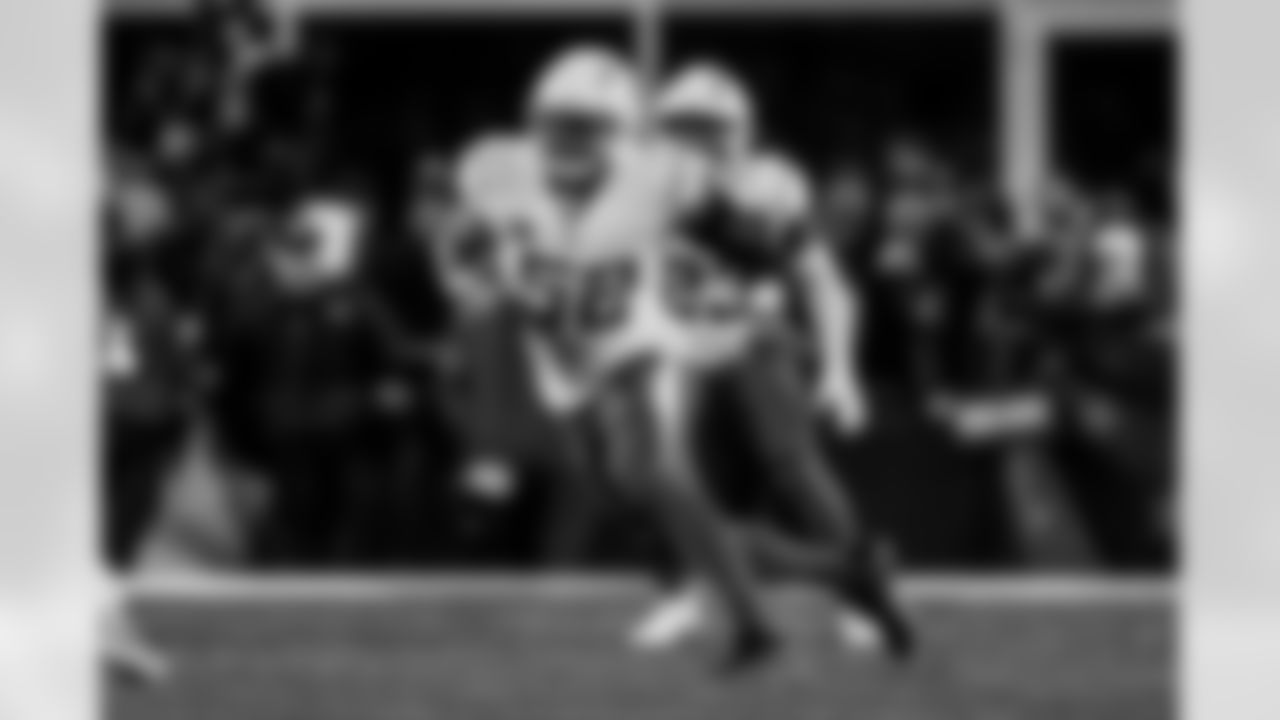 Check out the best shots from the Chargers Wild Card matchup against the Patriots!