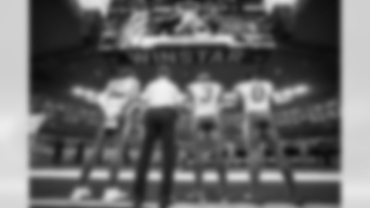 QB Justin Herbert (10), Head Coach Jim Harbaugh, S Derwin James Jr. (3) and LB Daiyan Henley (0)