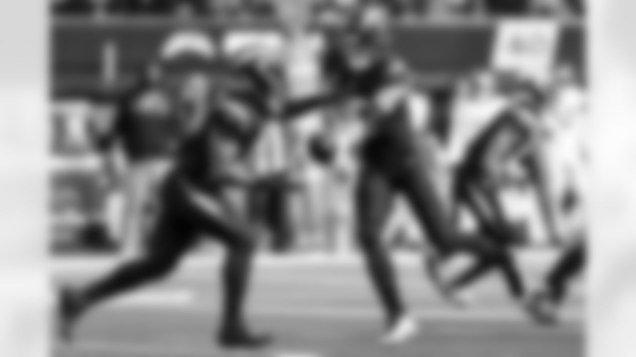 QB Justin Herbert (10) and RB Omarion Hampton (8)