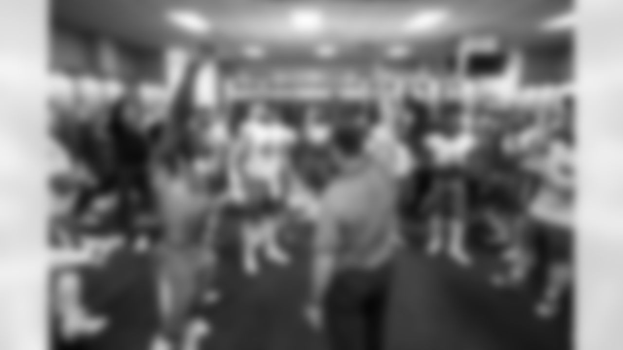 S Derwin James Jr. (3), DL Scott Matlock (44) and Head Coach Jim Harbaugh