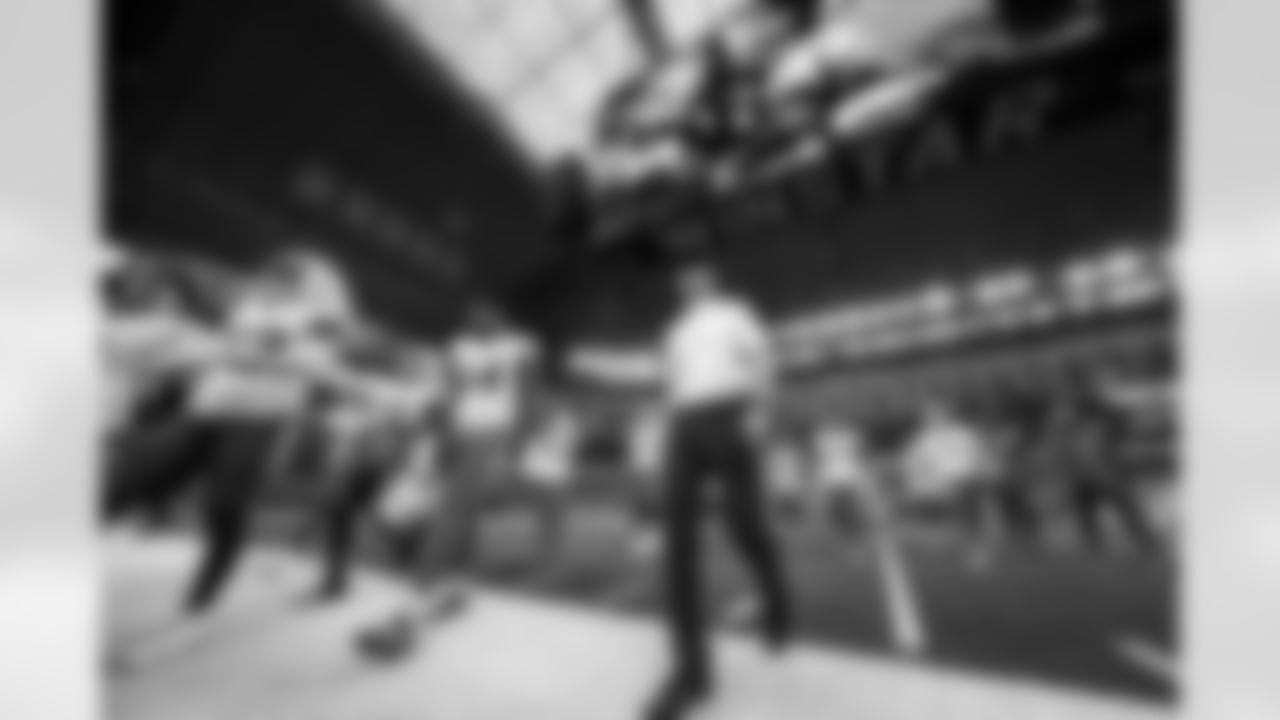 OLB Kyle Kennard (54) and Head Coach Jim Harbaugh