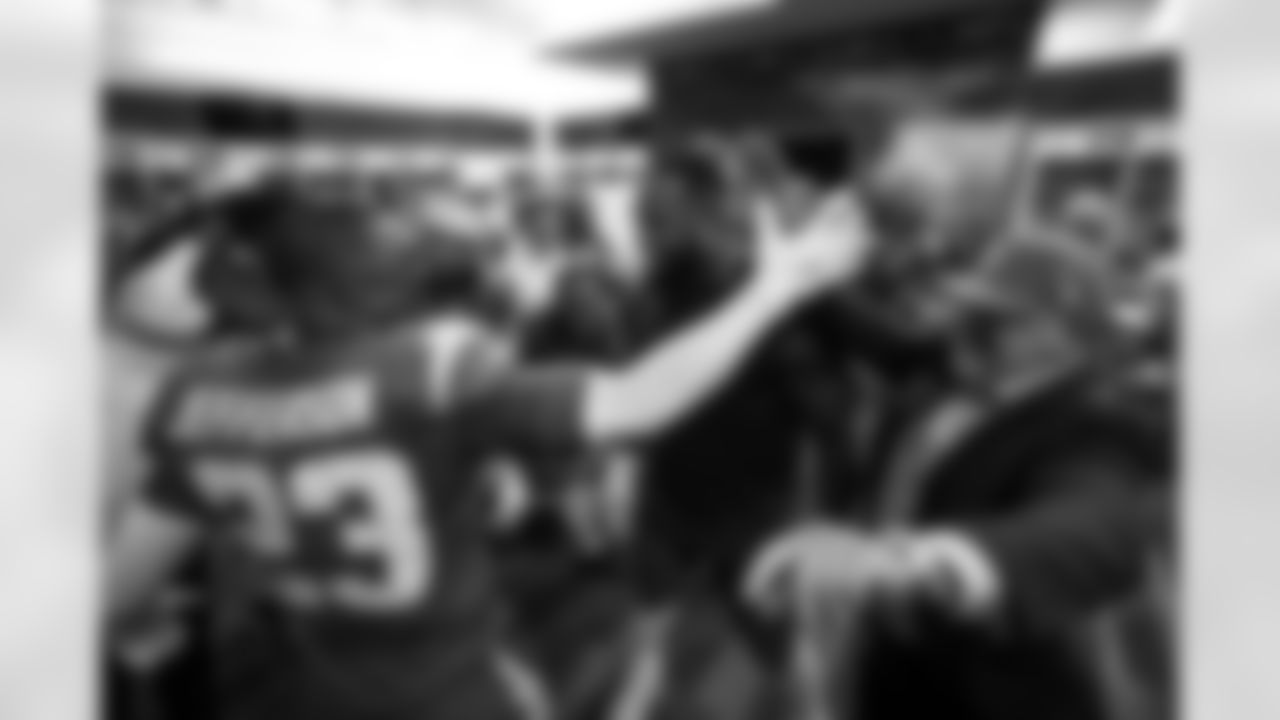 S Tony Jefferson (23), DL Da'Shawn Hand (91) and General Manager Joe Hortiz