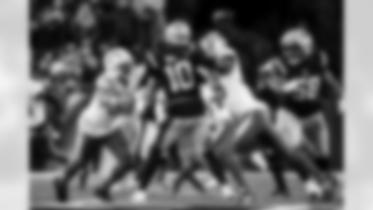 OLB Khalil Mack (52) and OLB Odafe Oweh (98)