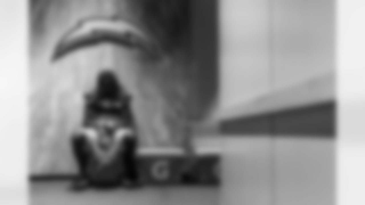 Moment of Reflection - A quiet moment for Donte Jackson ahead of Week 6 against the Dolphins. The visiting locker room in Miami is the one the Hurricanes use for their games, but the staff there has an LED sign for every NFL team to put up when they're using it and make it feel like home. Jackson takes some time to himself before padded warmups every game and this Sunday just happened to sit right under the bolt for his moment of reflection.