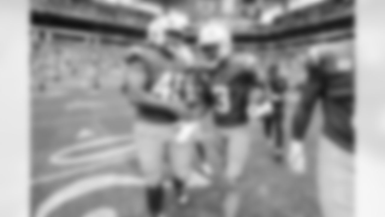 OLB Tuli Tuipulotu (45) and S Derwin James Jr. (3)