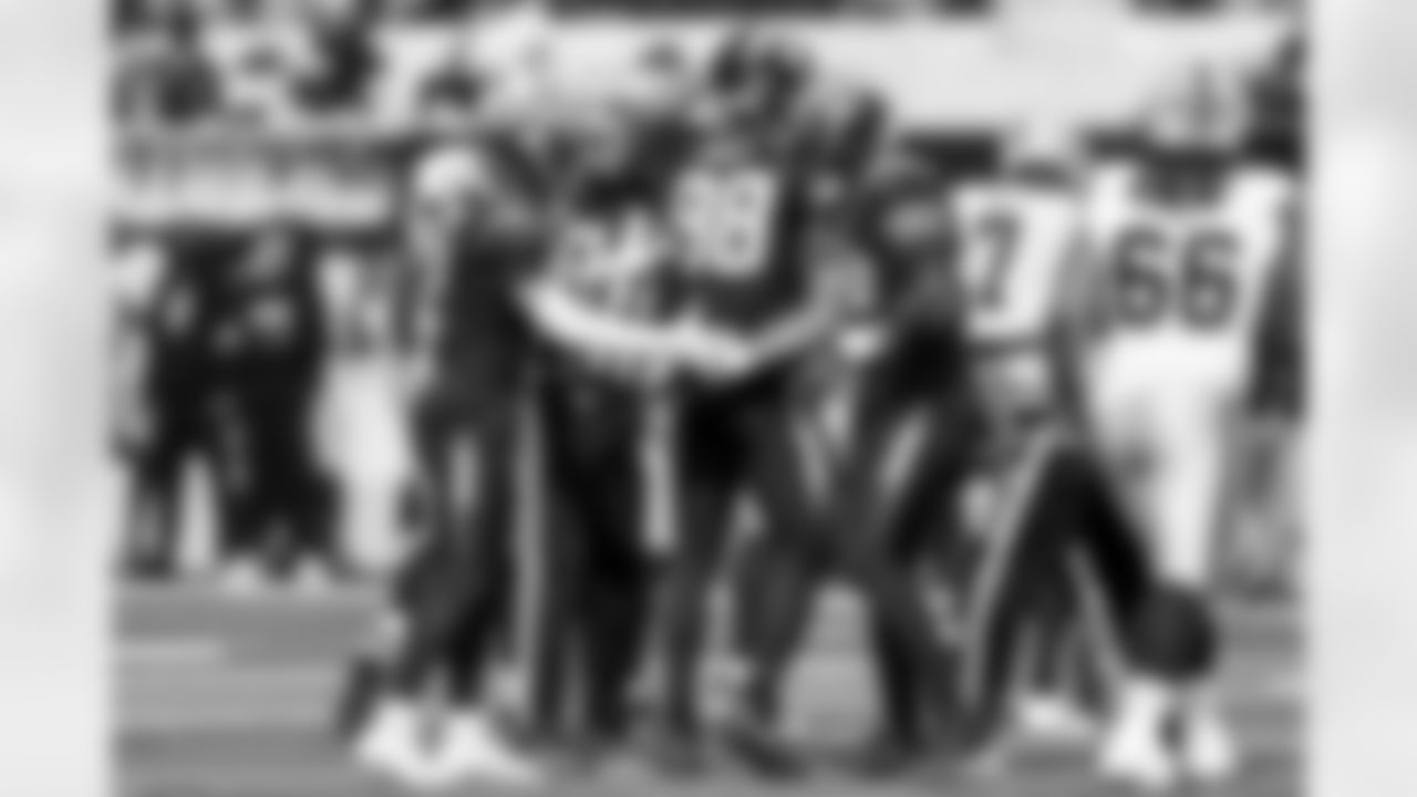 OLB Odafe Oweh (98), OLB Khalil Mack (52) and DB Elijah Molden (2)