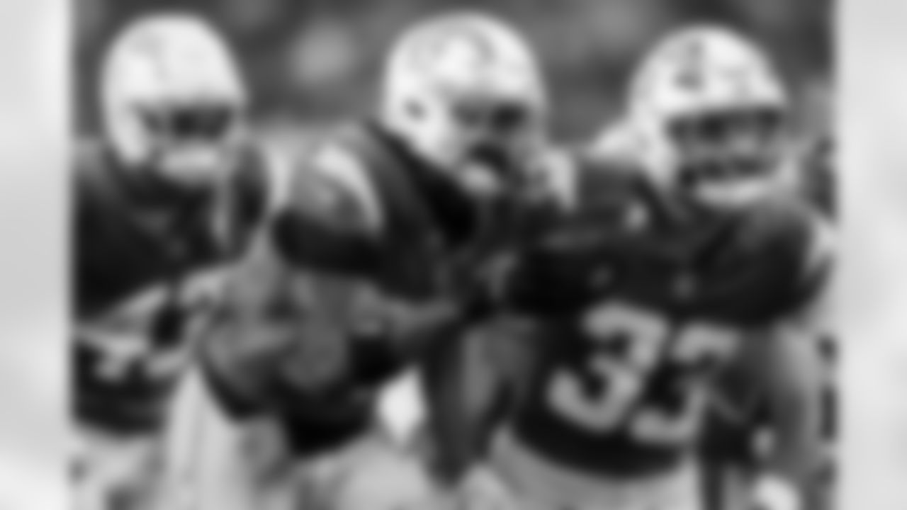 LB Del'Shawn Phillips (53) and DB Deane Leonard (33)