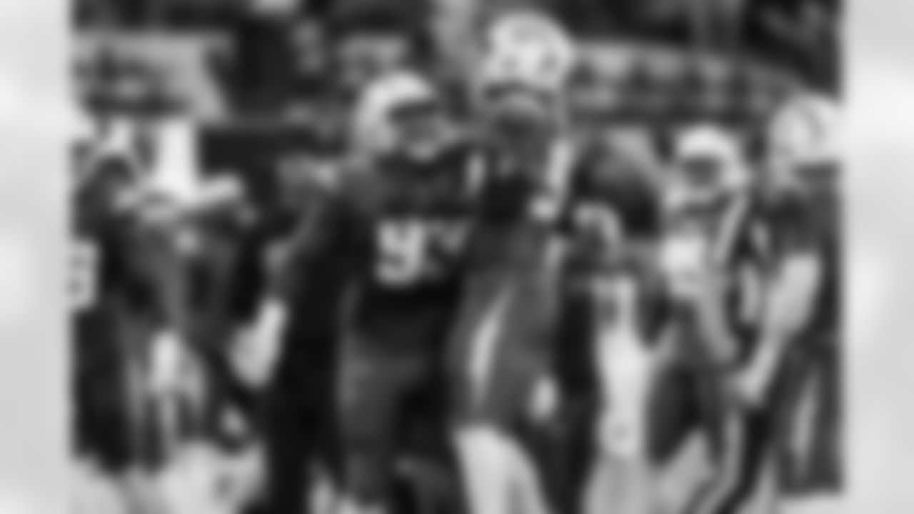 DL Otito Ogbonnia (93) and OLB Odafe Oweh (98)